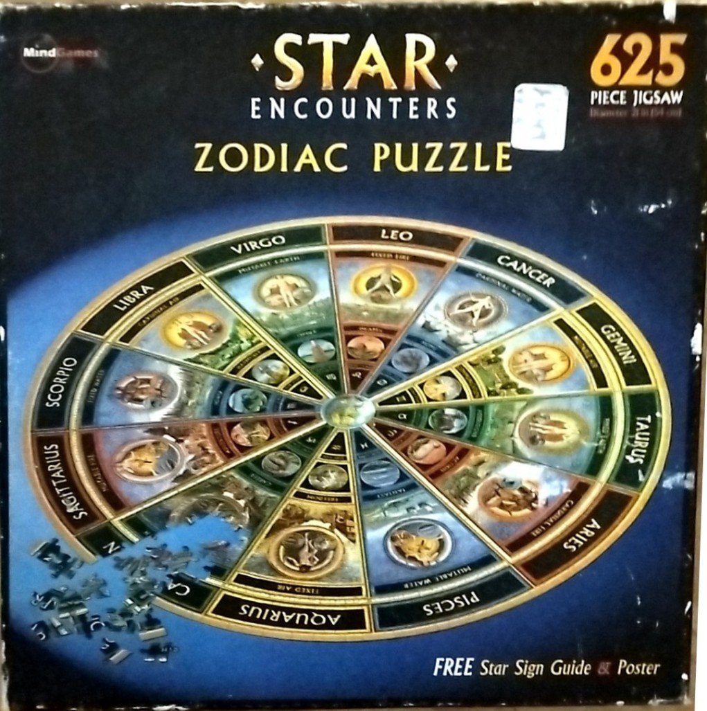 A circular zodiac wheel featuring the twelve astrological signs arranged around a central point against a blue cosmic backdro