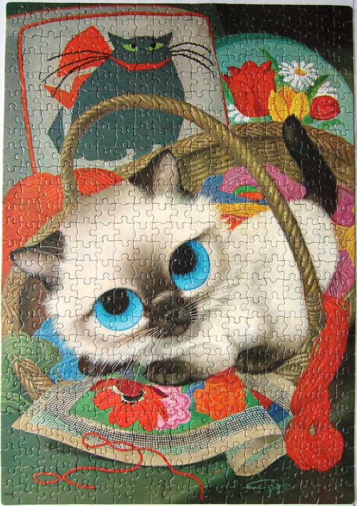 Illustration of a wide-eyed Siamese kitten sitting in a basket surrounded by colorful balls of yarn.