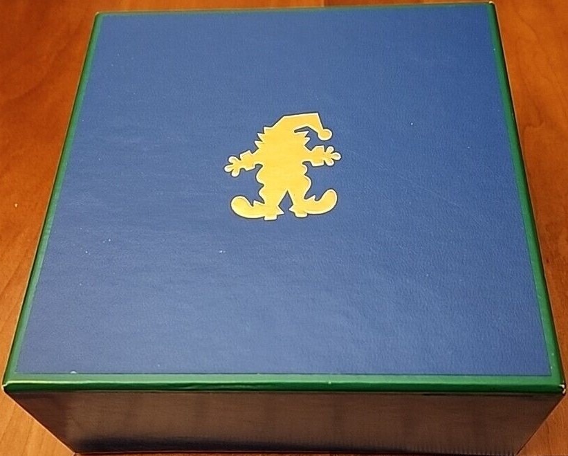 A flat yellow silhouette of a jester figure centered on a solid matte blue background.