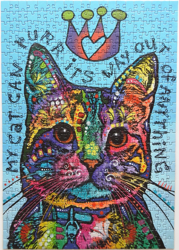 A brightly coloured, abstract pop-art portrait of a cat wearing a crown against a light blue background.