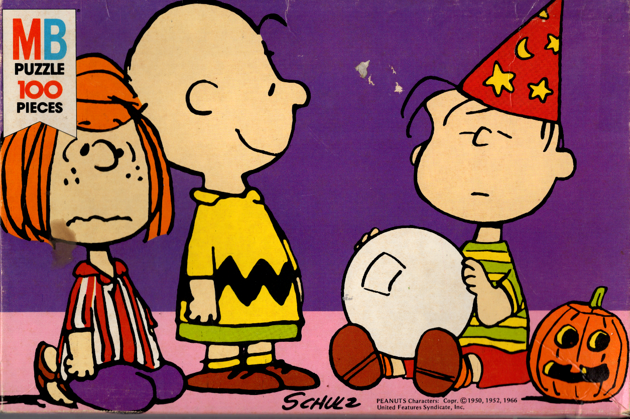 Charlie Brown, Peppermint Patty, and Linus at a Halloween celebration.