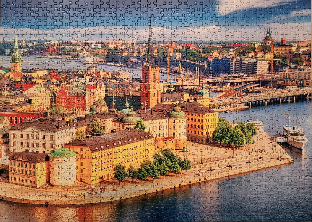 High-angle cityscape of Stockholm, Sweden, featuring Riddarholmen Church and the surrounding waterfront.