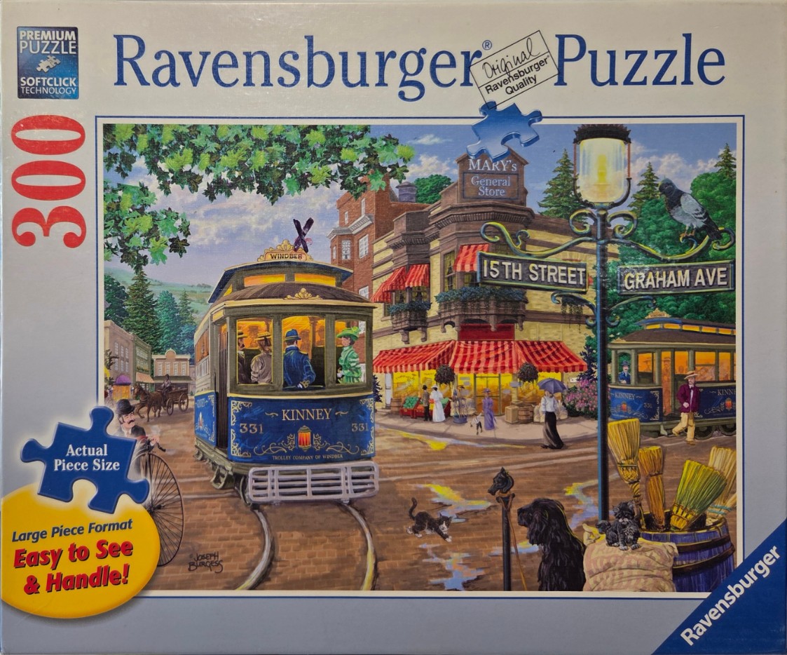 A nostalgic street scene featuring two vintage trolleys, a general store, and people in 19th-century attire.