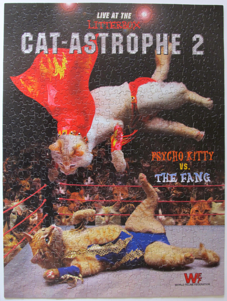 A professional wrestling match between two cats in a ring filled with cat spectators.