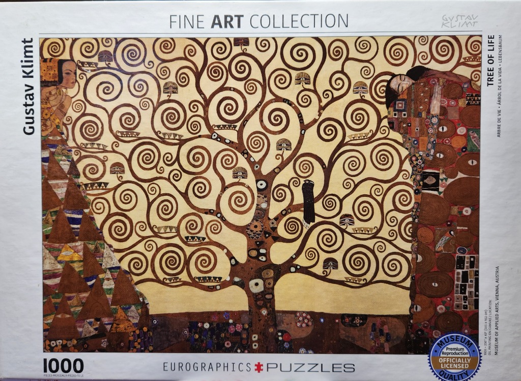 The Tree of Life by Gustav Klimt, a stylized golden tree with intricate swirling branches and two figures on either side.