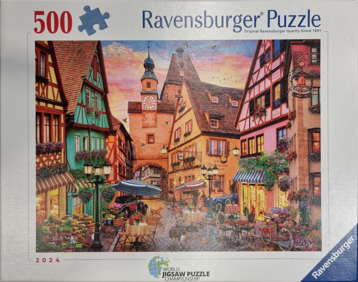 An illustration of a quaint European town square at sunset with half-timbered buildings and outdoor dining.