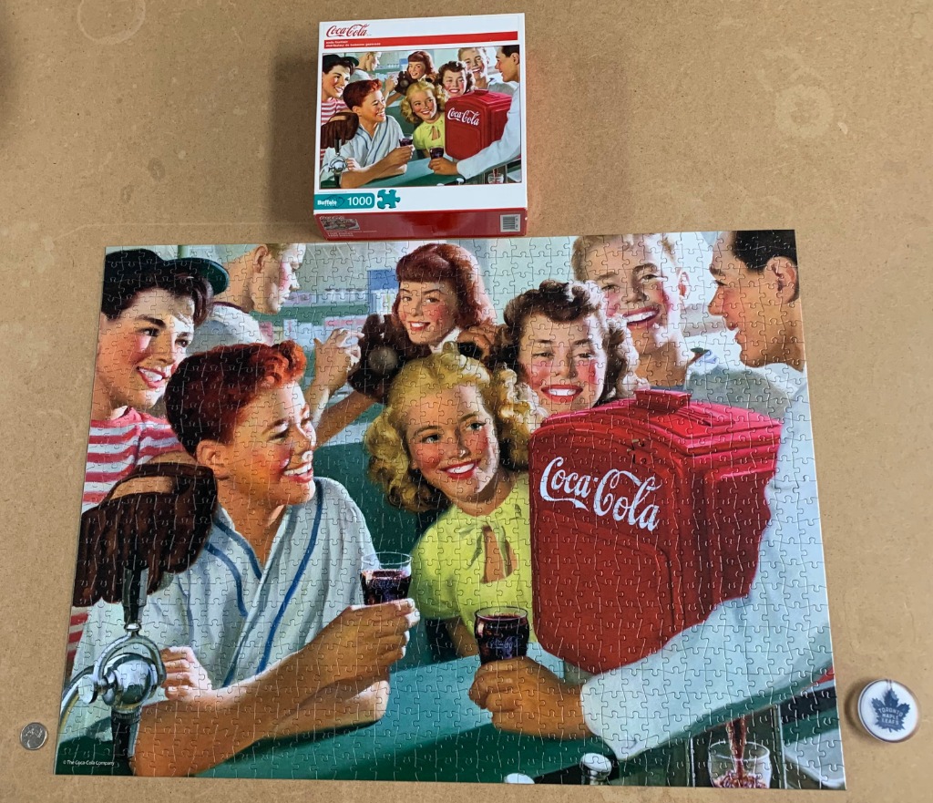 A nostalgic 1950s-style illustration of teenagers gathered around a bright red Coca-Cola dispenser in a soda shop.