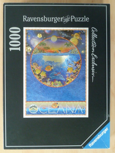 An illustration showing a circular view of a tropical ocean scene with fish and dolphins under a celestial sky.