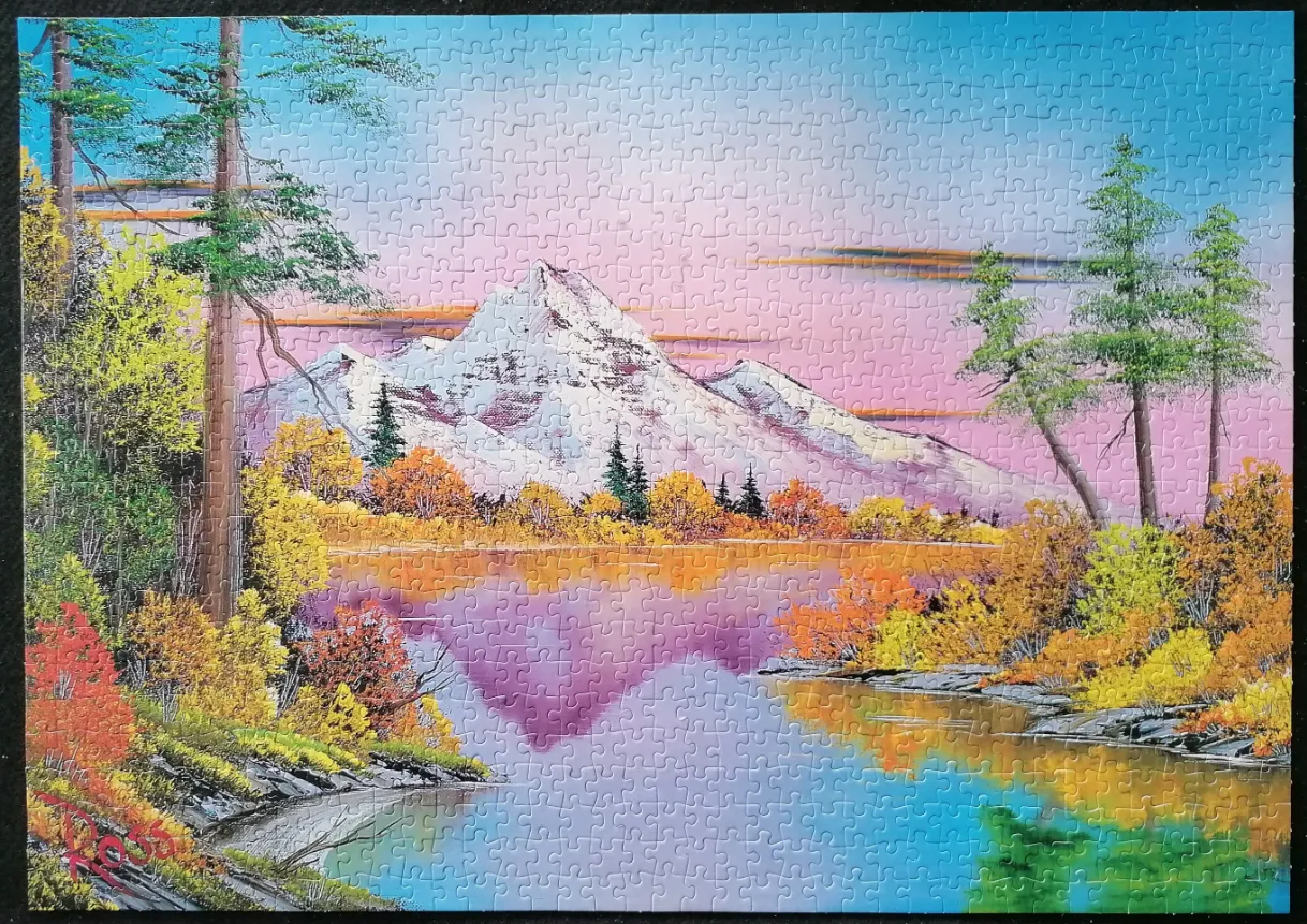 A peaceful landscape painting of snow-capped mountains reflecting in a lake surrounded by autumn trees at sunset.