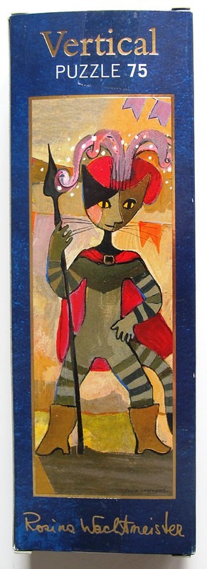 Stylized illustration of a cat wearing a jester-like hat, cloak, and boots, holding a staff.