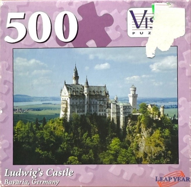 Photograph of Neuschwanstein Castle perched on a forested hilltop in Bavaria, Germany.