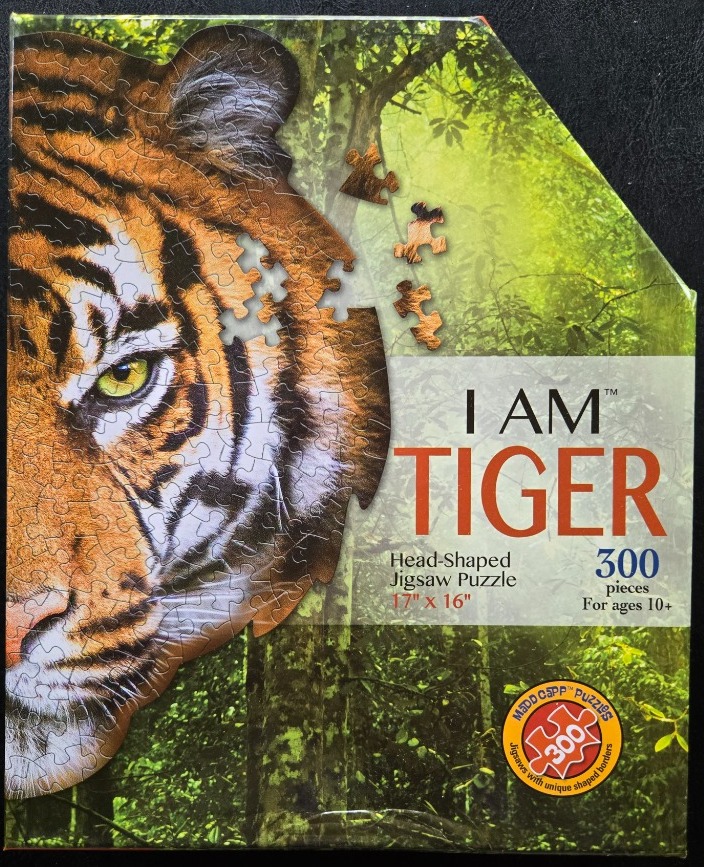 Close-up portrait of a tiger head against a vibrant green jungle backdrop