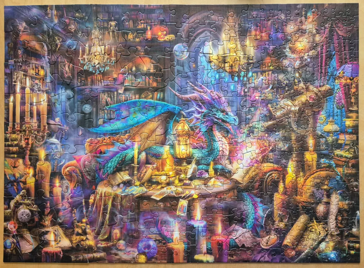 Fantasy illustration of a teal dragon with purple horns resting in a magical, candlelit library.