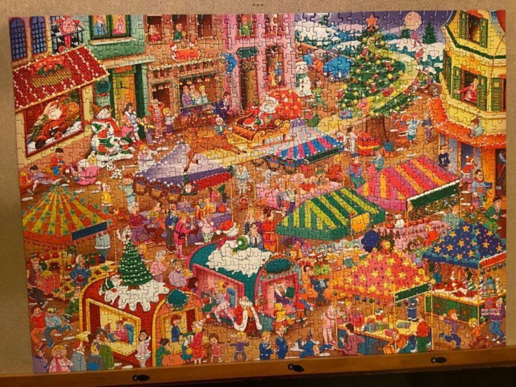 A bustling, vibrant Christmas market scene with stalls, shoppers, and Santa in a sleigh.