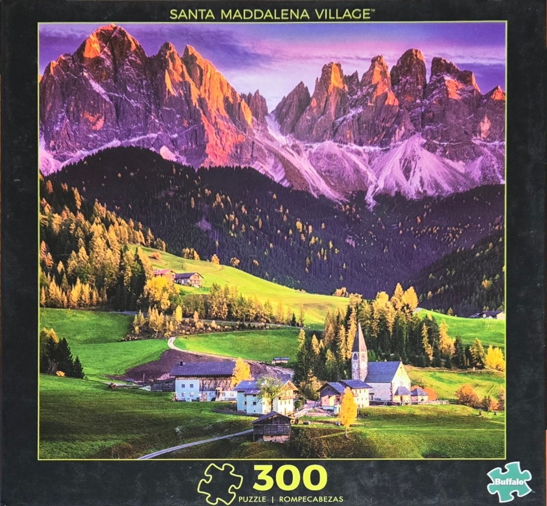 Santa Maddalena village nestled in a lush valley beneath the jagged, sunlit peaks of the Italian Dolomites.