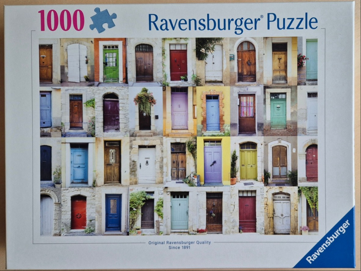 A collage of 32 colorful, unique antique wooden doors from various European-style stone buildings.