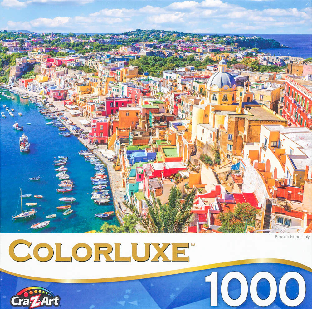 High-angle photograph of the colorful hillside town and harbor of Procida Island, Italy.