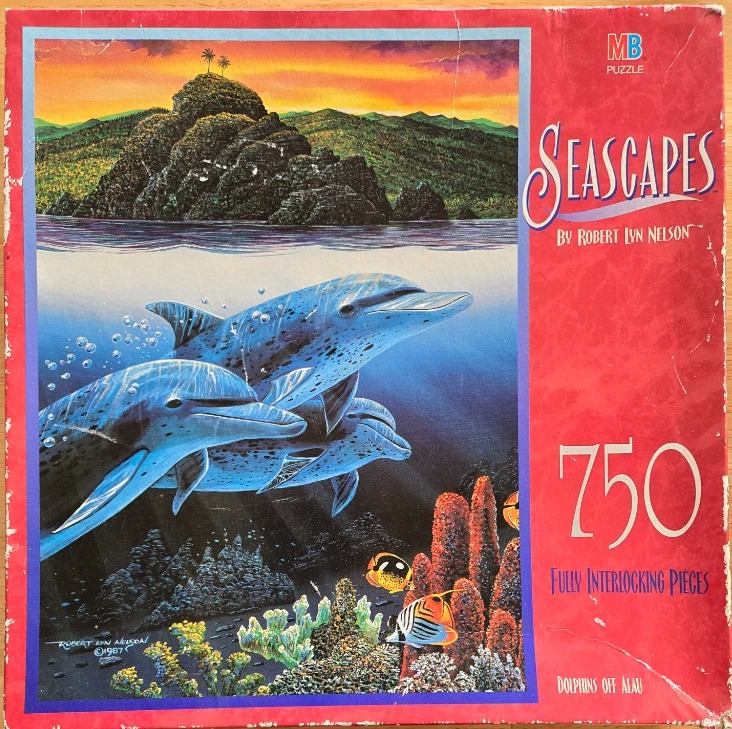 A split-view painting featuring dolphins swimming underwater with a tropical island and sunset above.