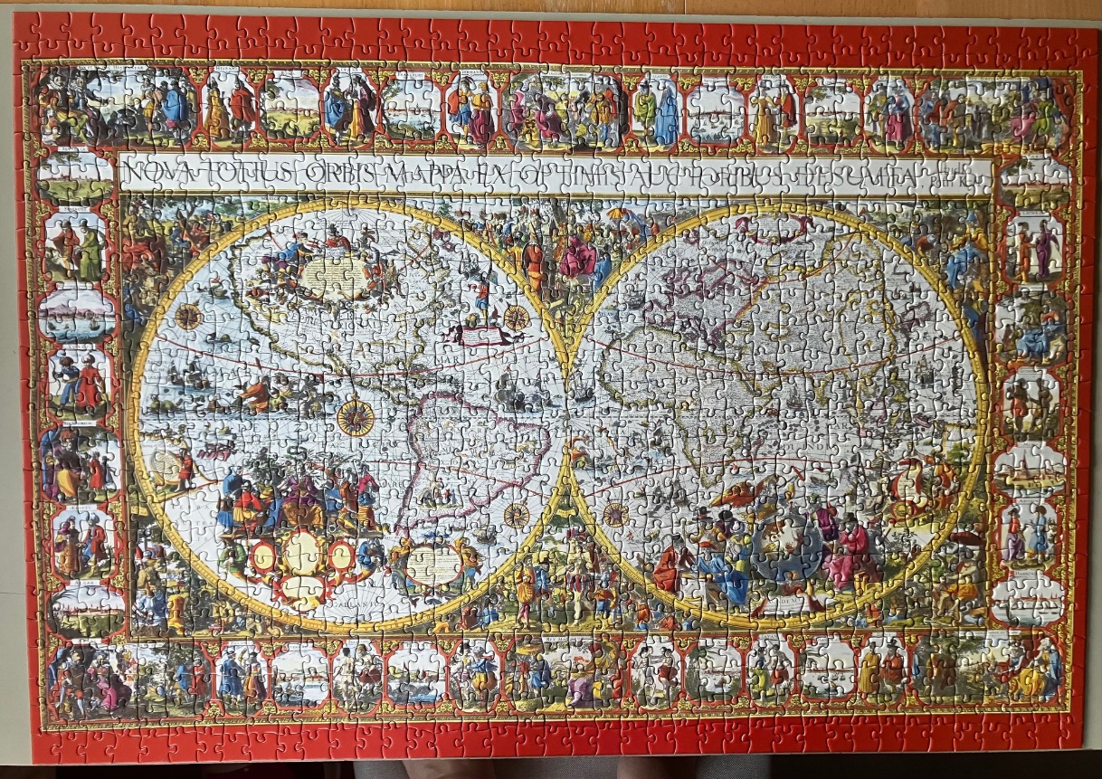 A vintage-style double-hemisphere world map surrounded by ornate, colourful borders depicting people and cities.