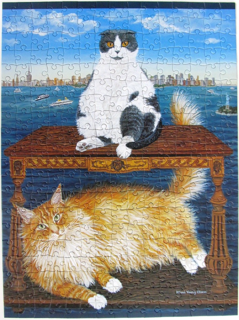 An oil painting of a black and white cat sitting on a table above a fluffy orange cat in front of a harbor skyline.