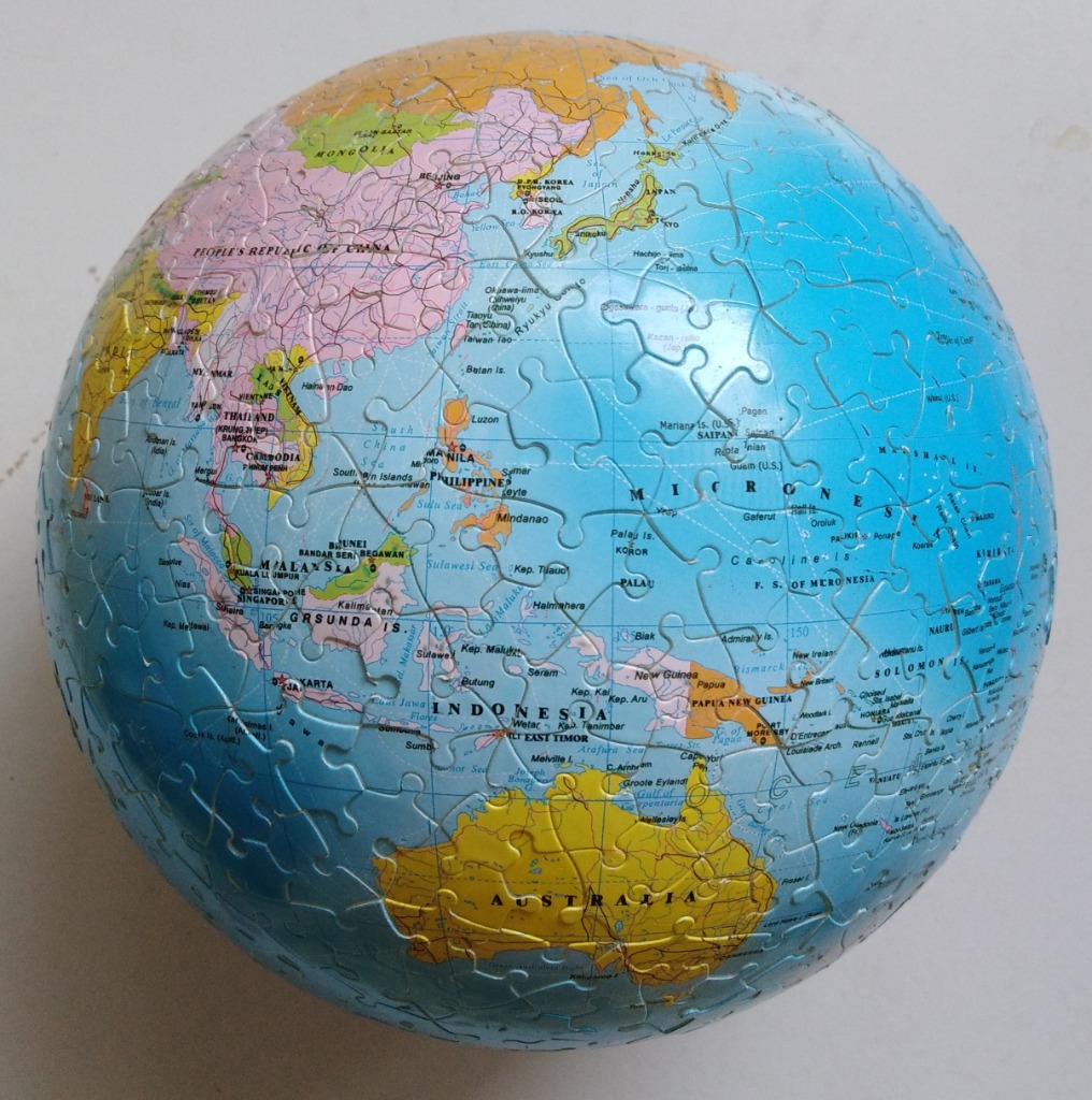 A spherical globe showing Southeast Asia, Australia, and the Pacific Ocean.