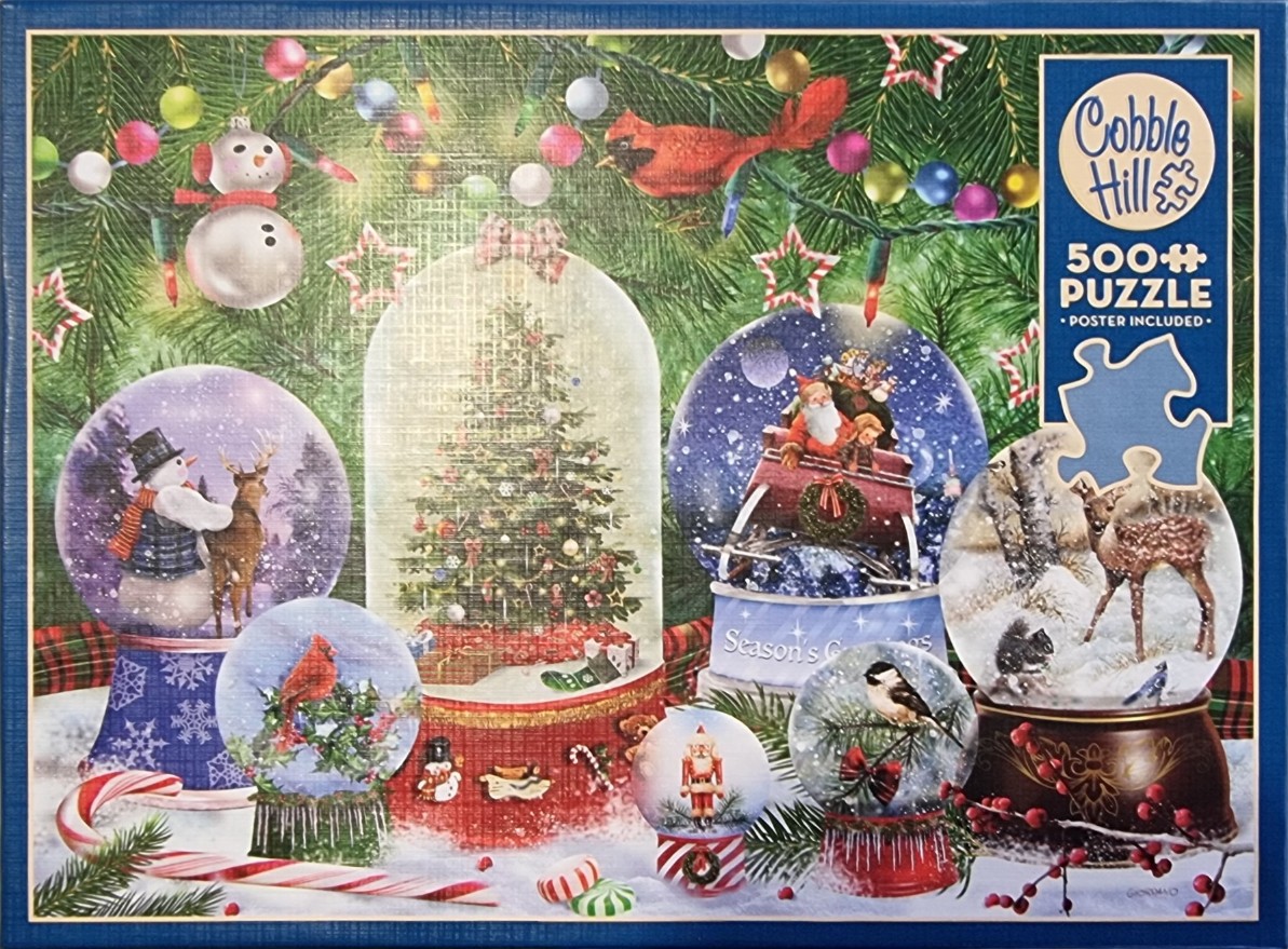 A collection of Christmas snow globes nestled under a pine tree with fairy lights and ornaments.