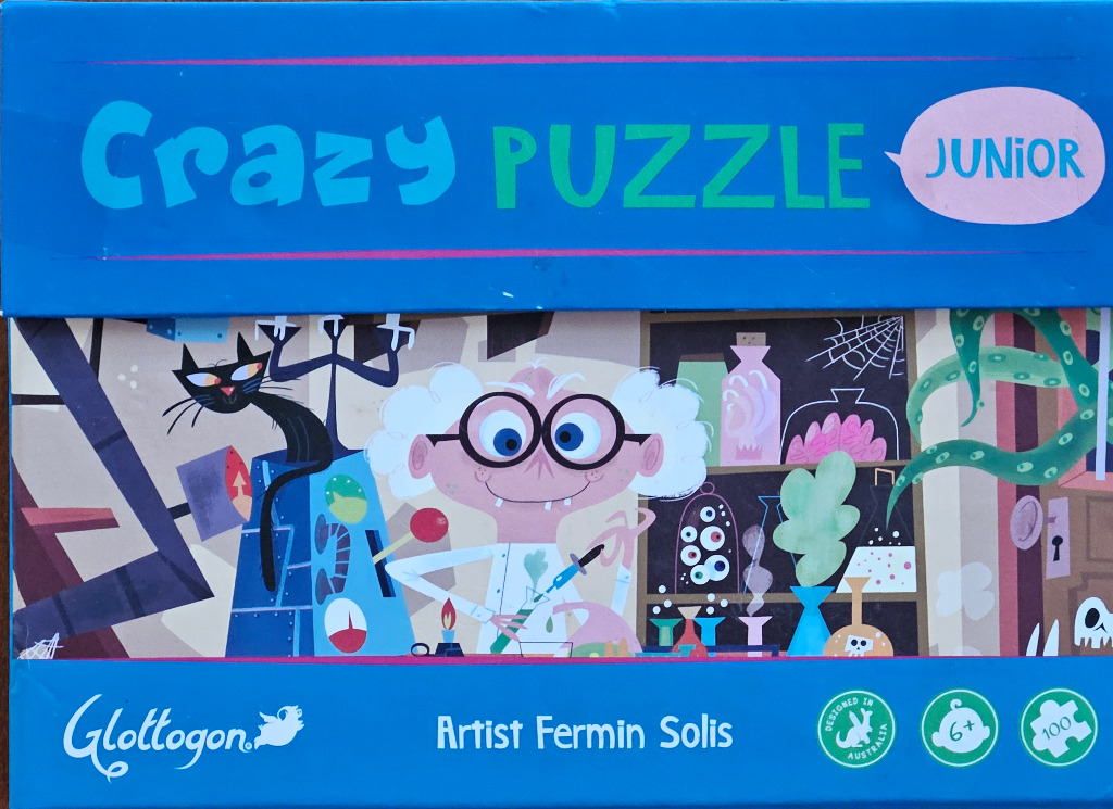 Cartoon illustration of a mad scientist in his laboratory with a black cat, beakers, and test tubes.