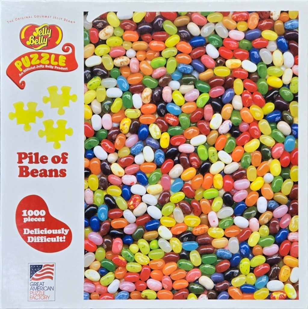 A dense, vibrant pile of multi-colored jelly beans covering the entire right two-thirds of the frame.