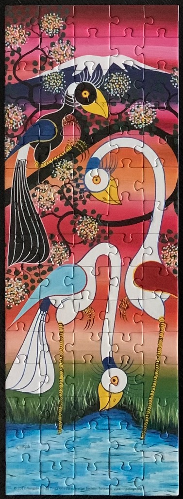 Tingatinga style painting of birds by a lake in front of a mountain at sunset.