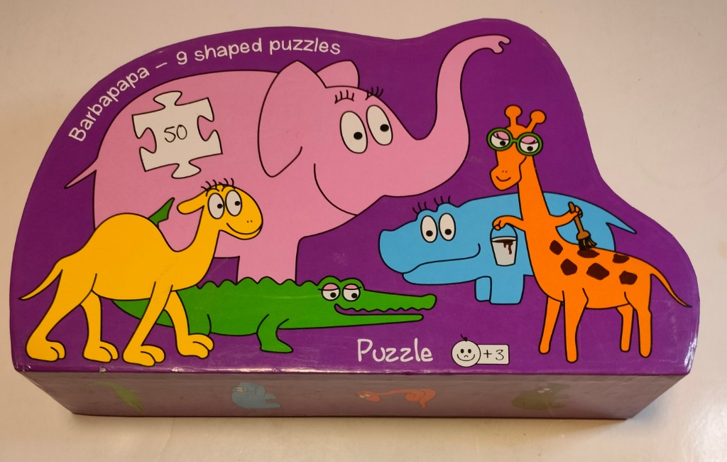 Colorful cartoon animals including a pink elephant, yellow camel, green crocodile, blue hippo, and an orange giraffe.