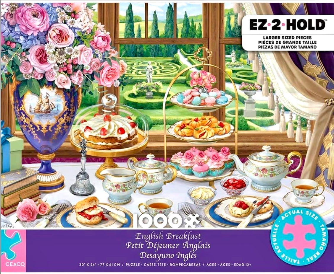 A table laid for an English breakfast featuring pastries, tea, and a large floral arrangement in front of a garden window.