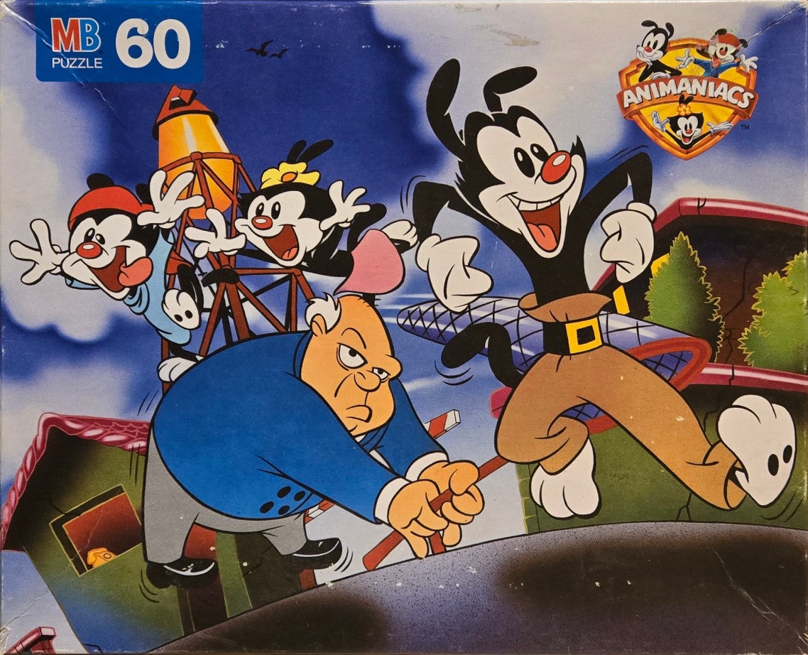 The Animaniacs characters Yakko, Wakko, and Dot running away from an angry man in a blue coat.