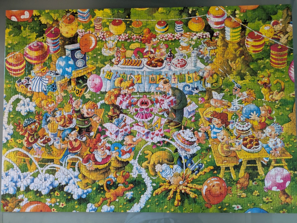 A chaotic cartoon birthday party scene filled with characters, balloons, and scattered food.