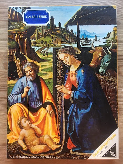 A Renaissance-style oil painting of the Nativity scene featuring Mary, Joseph, and the infant Jesus.