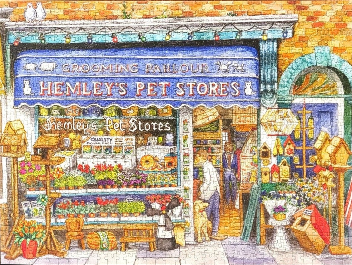 Illustration of a quaint pet store storefront with a blue awning, plants, birdhouses, and a golden retriever outside.