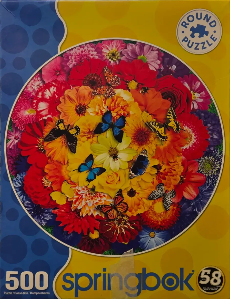 Circular arrangement of vibrant flowers and butterflies in various colors