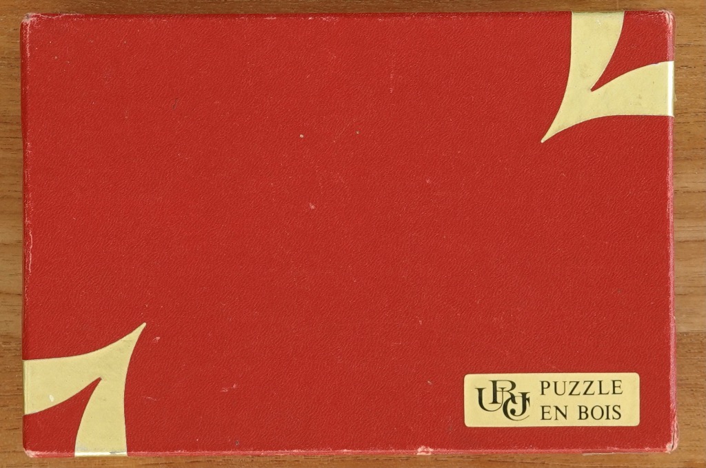 A solid red background with gold abstract corner accents and a small rectangular label in the bottom right corner.