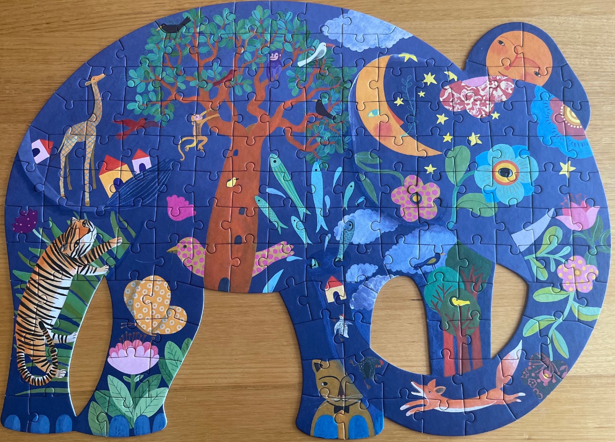 An elephant-shaped illustration featuring a whimsical jungle scene with various animals, flowers, and celestial bodies.