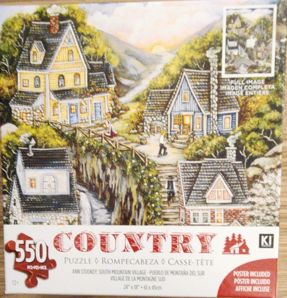 A peaceful village nestled in a lush, rolling mountain landscape at sunset.