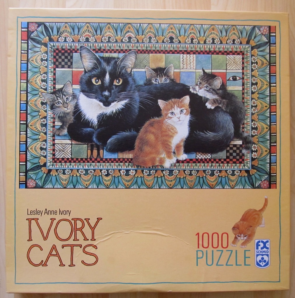 An illustration of a large black and white cat surrounded by four smaller kittens on a patterned mat.