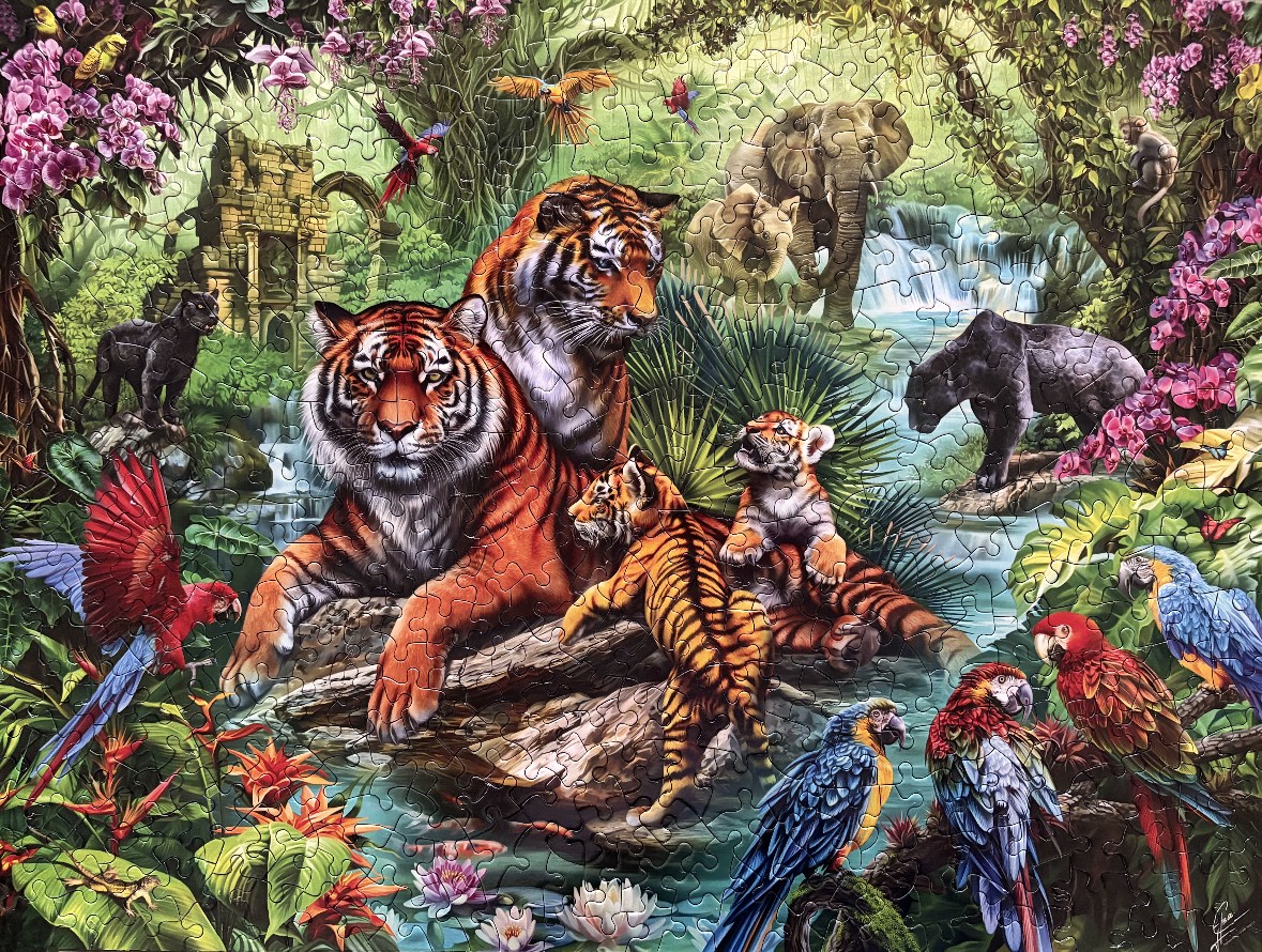 A lush jungle scene with a family of tigers and various exotic animals around a waterfall.