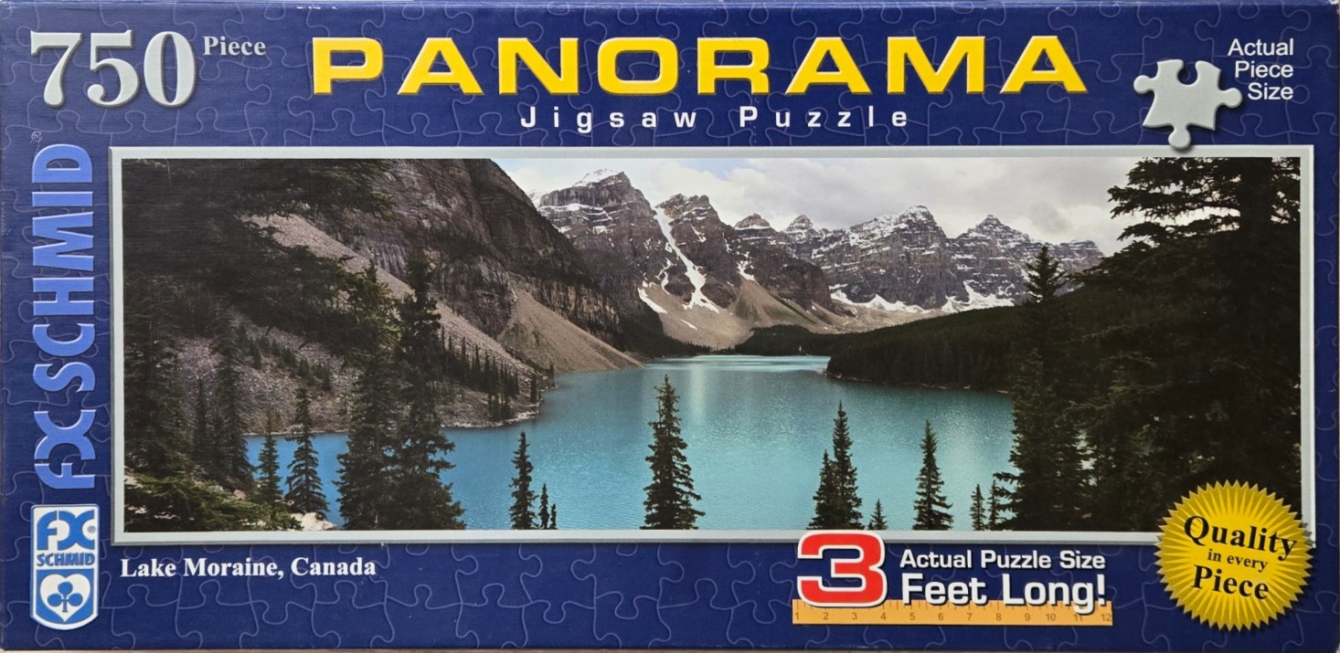 A panoramic photograph of the turquoise-colored Moraine Lake in Canada, framed by jagged, snow-dusted mountains.