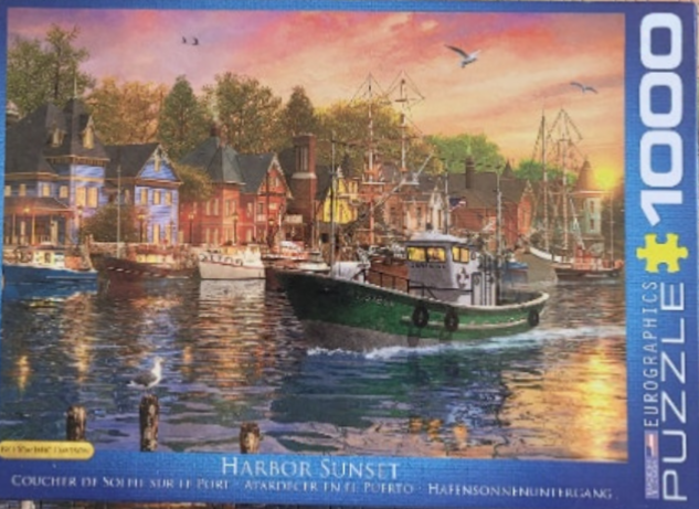 A peaceful harbor scene at sunset featuring a fishing boat, sailing vessels, and quaint coastal homes.