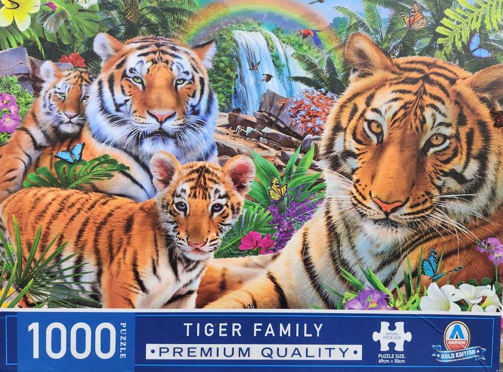 A lush tropical scene featuring a tiger family with three tigers amidst jungle flora and a waterfall.