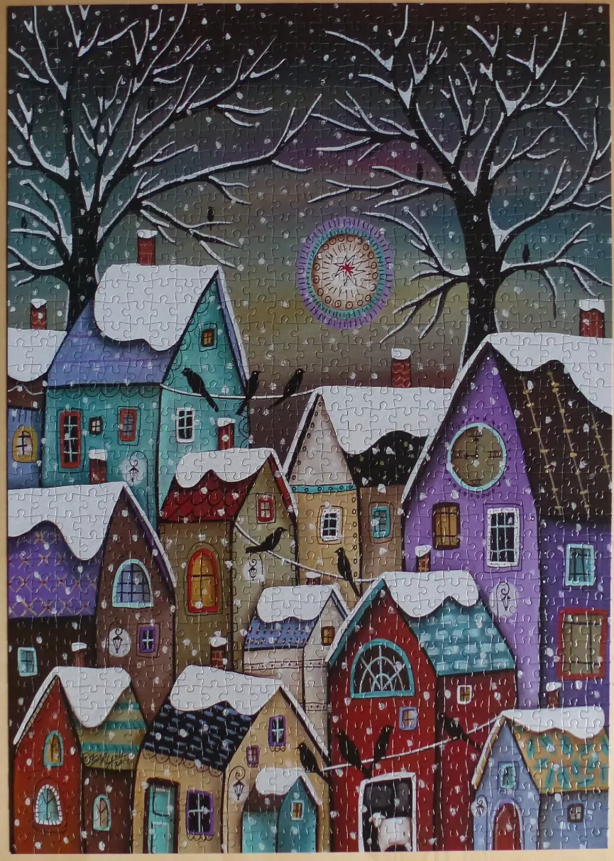 Whimsical snowy winter village scene at night with colourful houses and ravens
