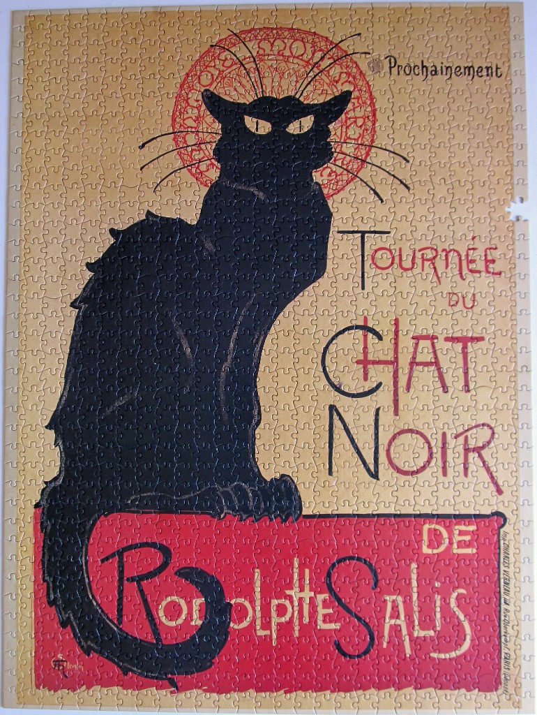 A vintage-style illustration of a black cat with a red halo, advertising the Tournee du Chat Noir.