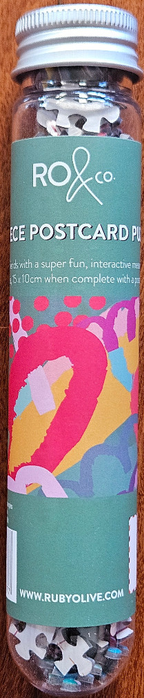 Abstract art pattern with pink, yellow, and blue organic shapes on a sage green background
