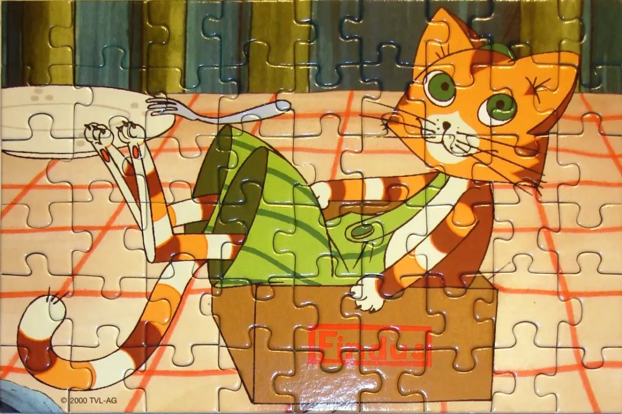 Cartoon cat sitting in a cardboard box at a table