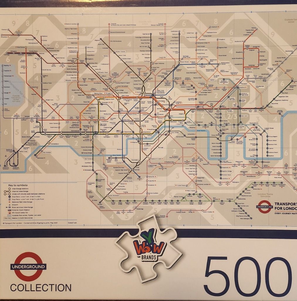 A detailed schematic map of the London Underground transit network with various coloured train lines and fare zones.
