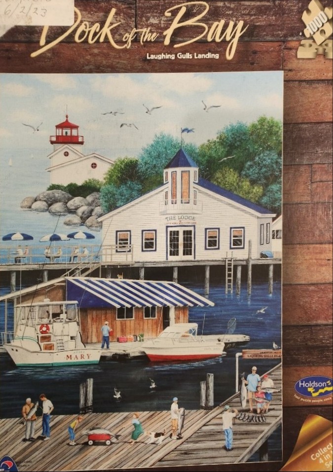 A peaceful coastal scene with a white lodge, lighthouse, and fishermen on a wooden dock.